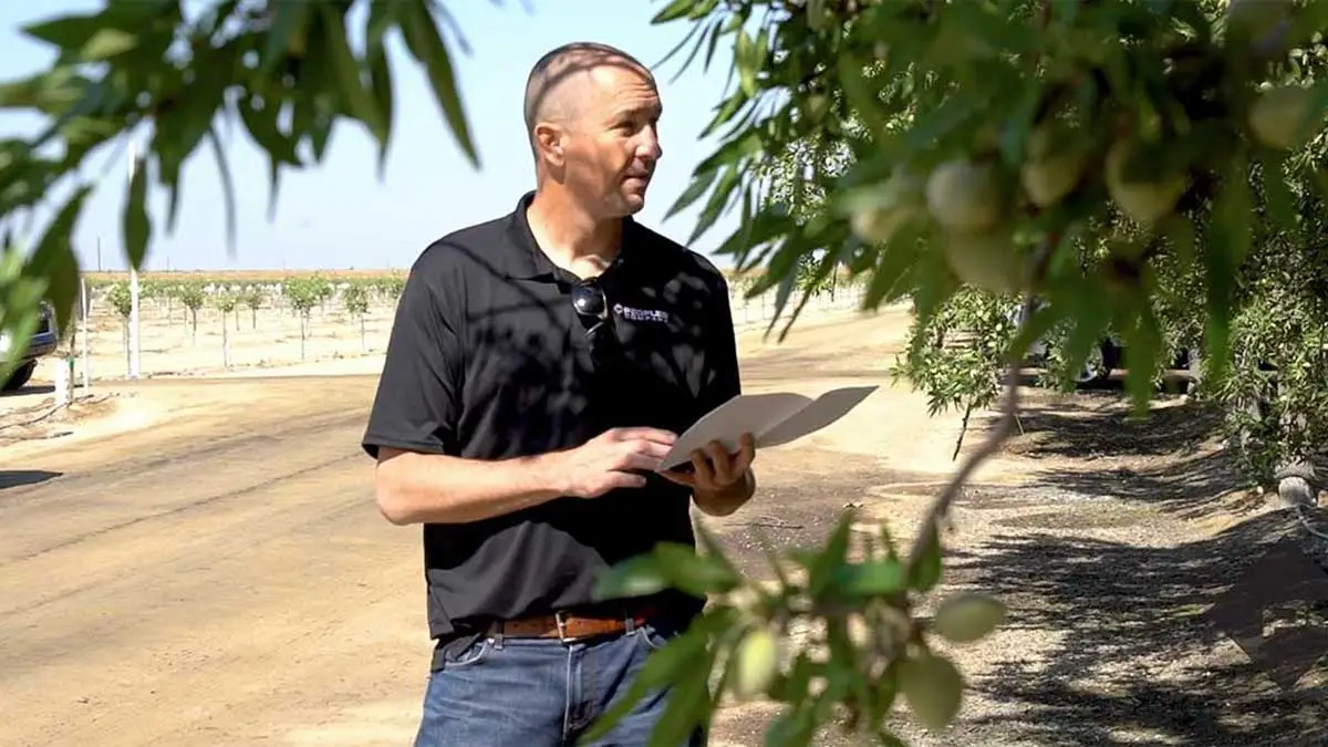 An appraiser documenting a tract of farmland