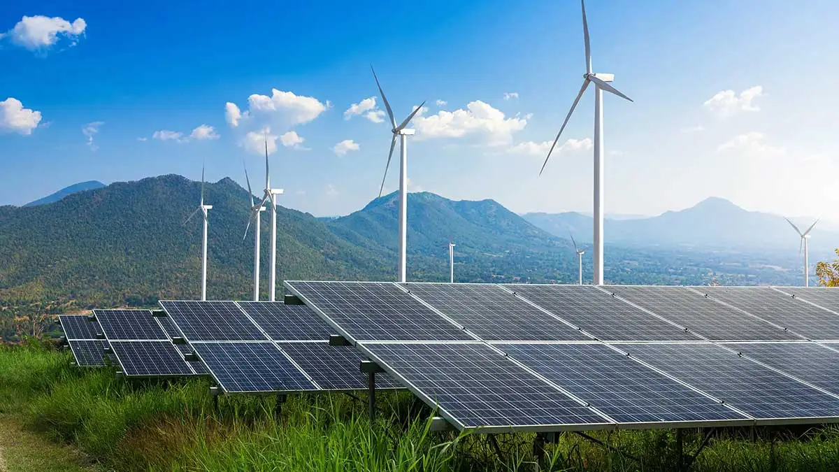 Wind turbines standing in cultivated farmland